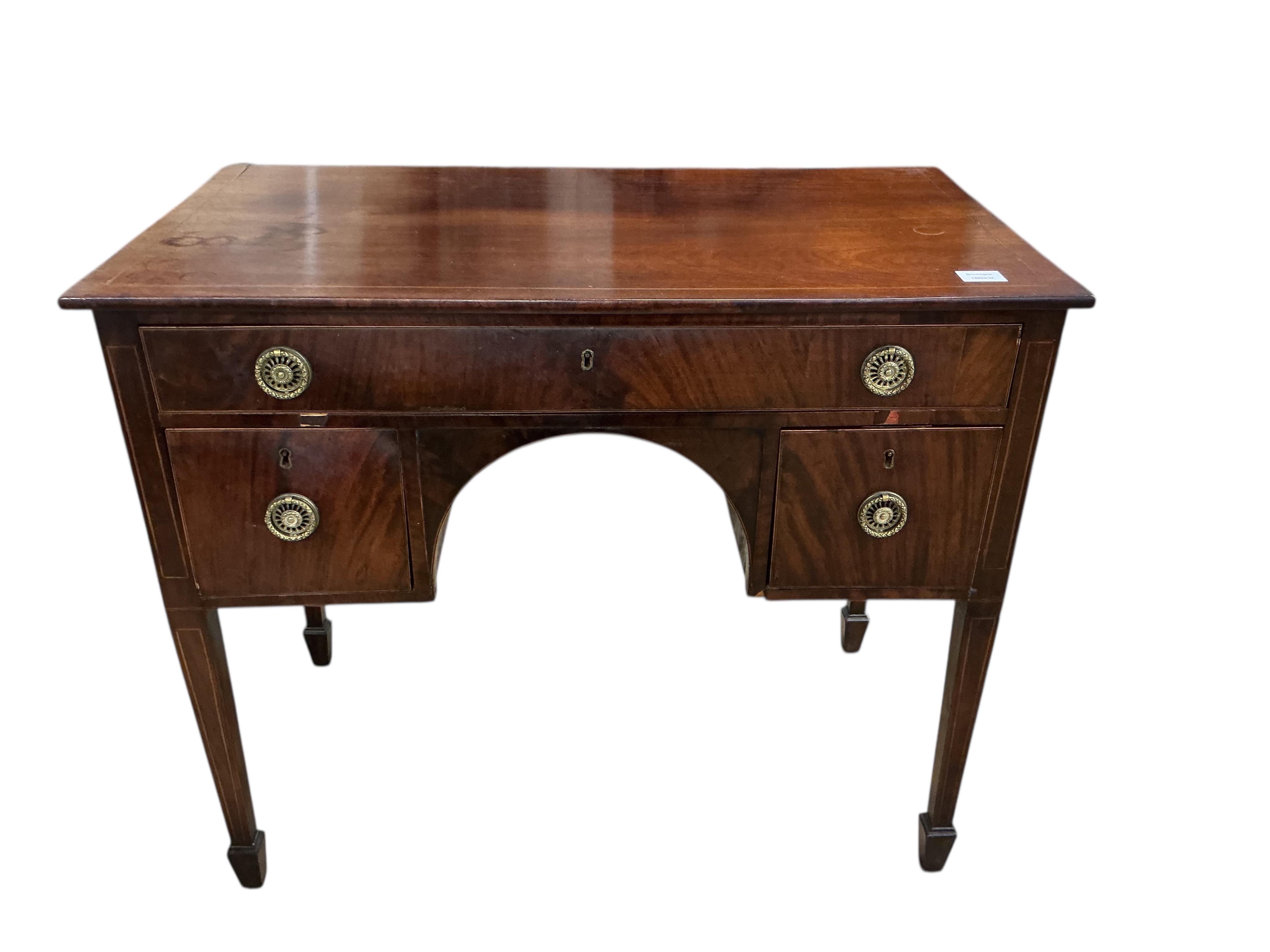 A George III rectangular inlaid mahogany kneehole dressing table, fitted one long and two short drawers, width 91cm, depth 49cm, height 75cm